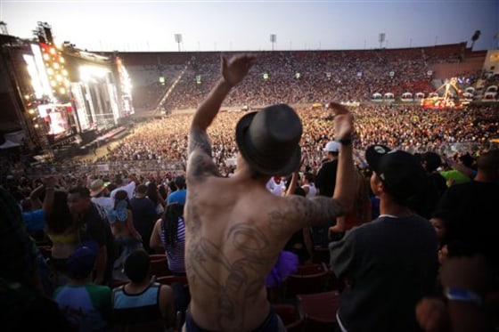 People dance during the Electric Daisy Carnival rave at Exposition Park and LA Coliseum on June 26, 2010, in Los Angeles. Las Vegas is opening its arms to the popular electronic music festival that was shunned in Los Angeles after a 15-year-old girl died of an ecstasy overdose last year. 